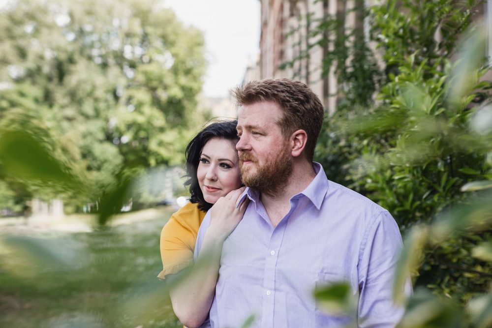 couple hugging in a green garden in Edinburgh